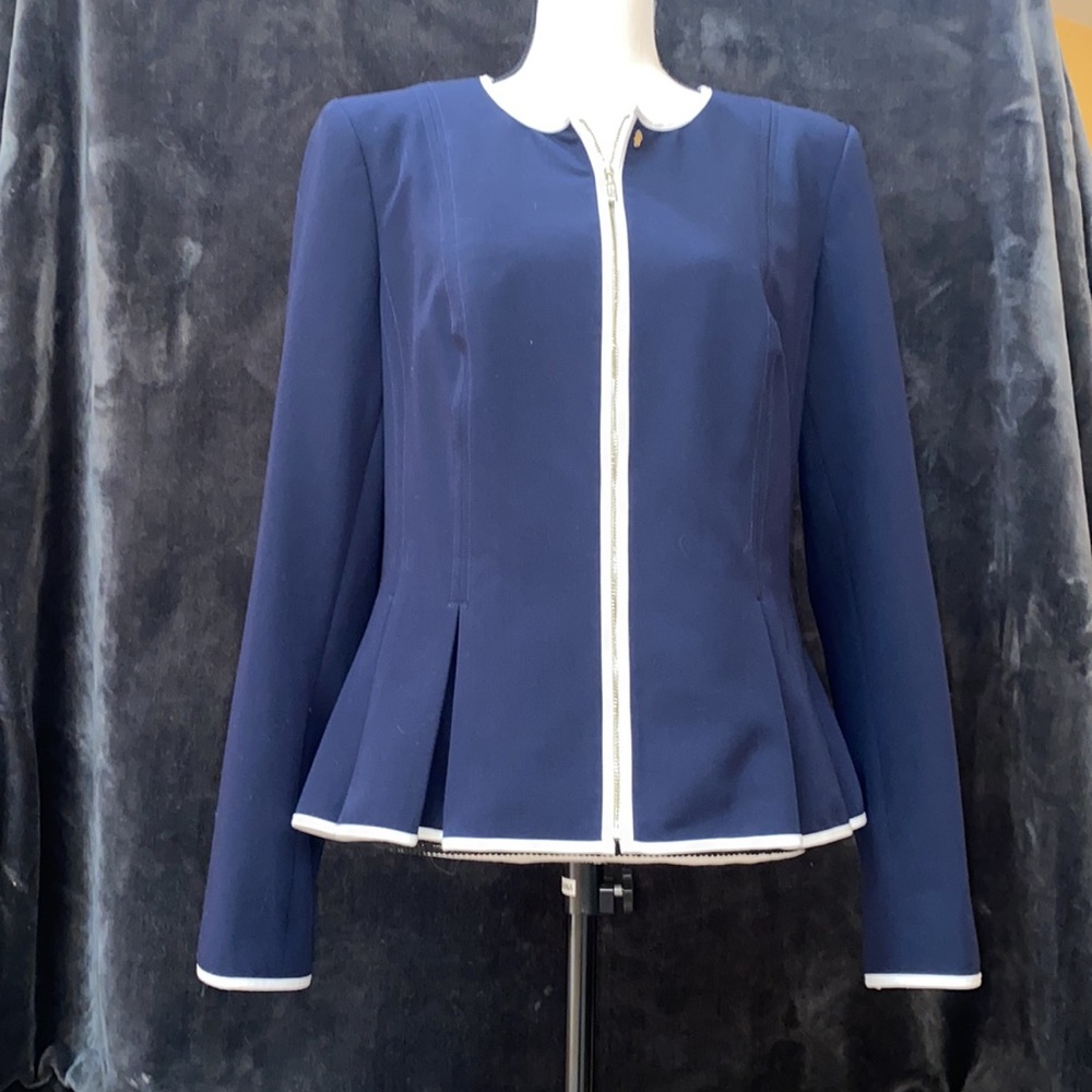 Tommy Hilfiger zip-front collarless blazer with white trim and peplum hem.